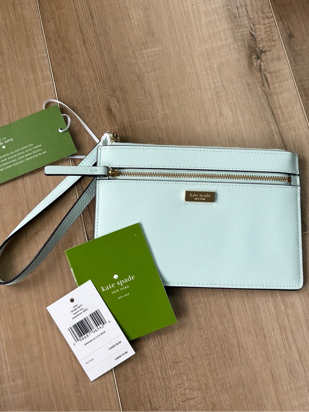 kate spade mint wristlet with gold hardware